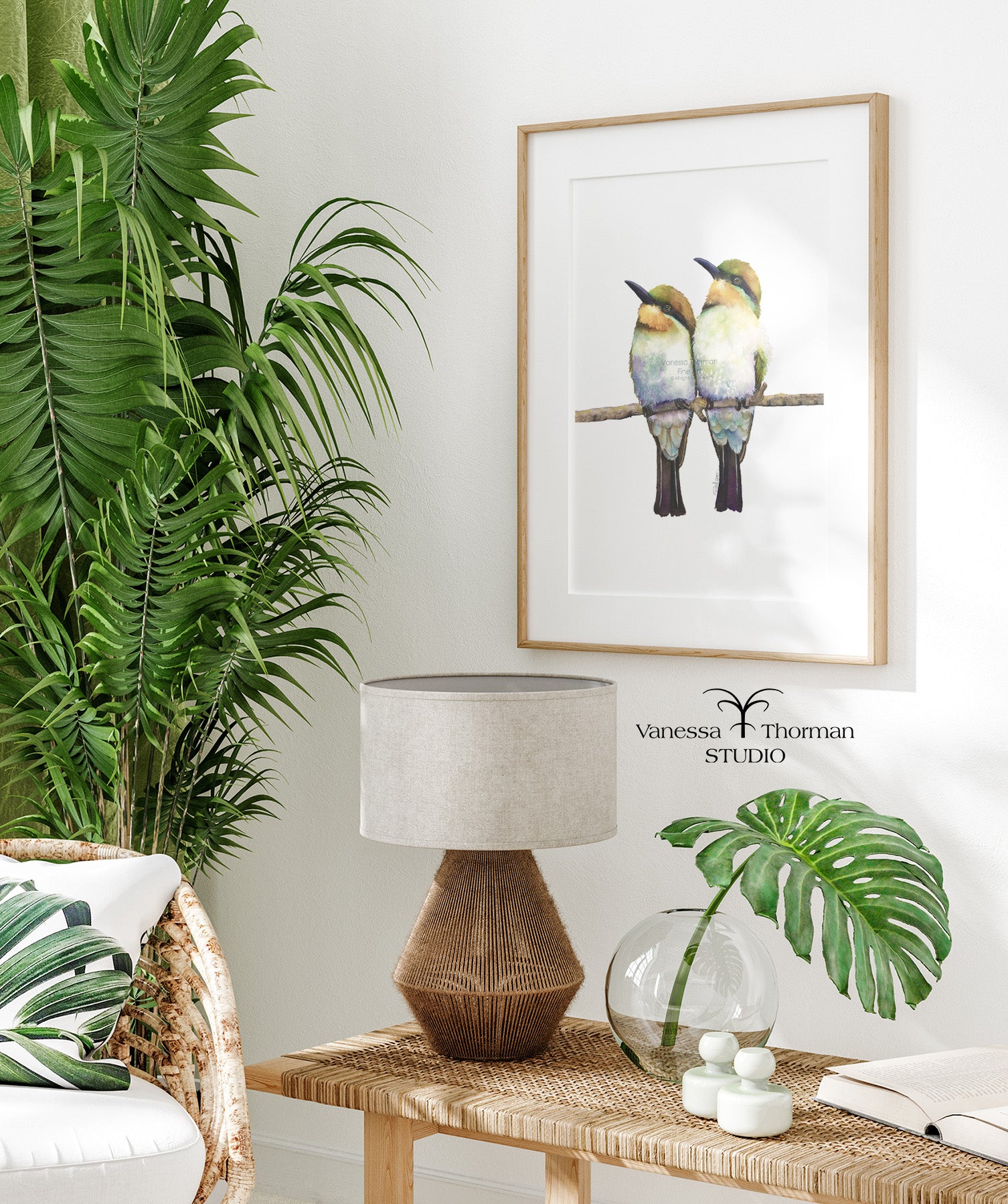 Framed "Birds of a Feather" Bee-Eater watercolor art print by Vanessa Thorman hanging in a room.