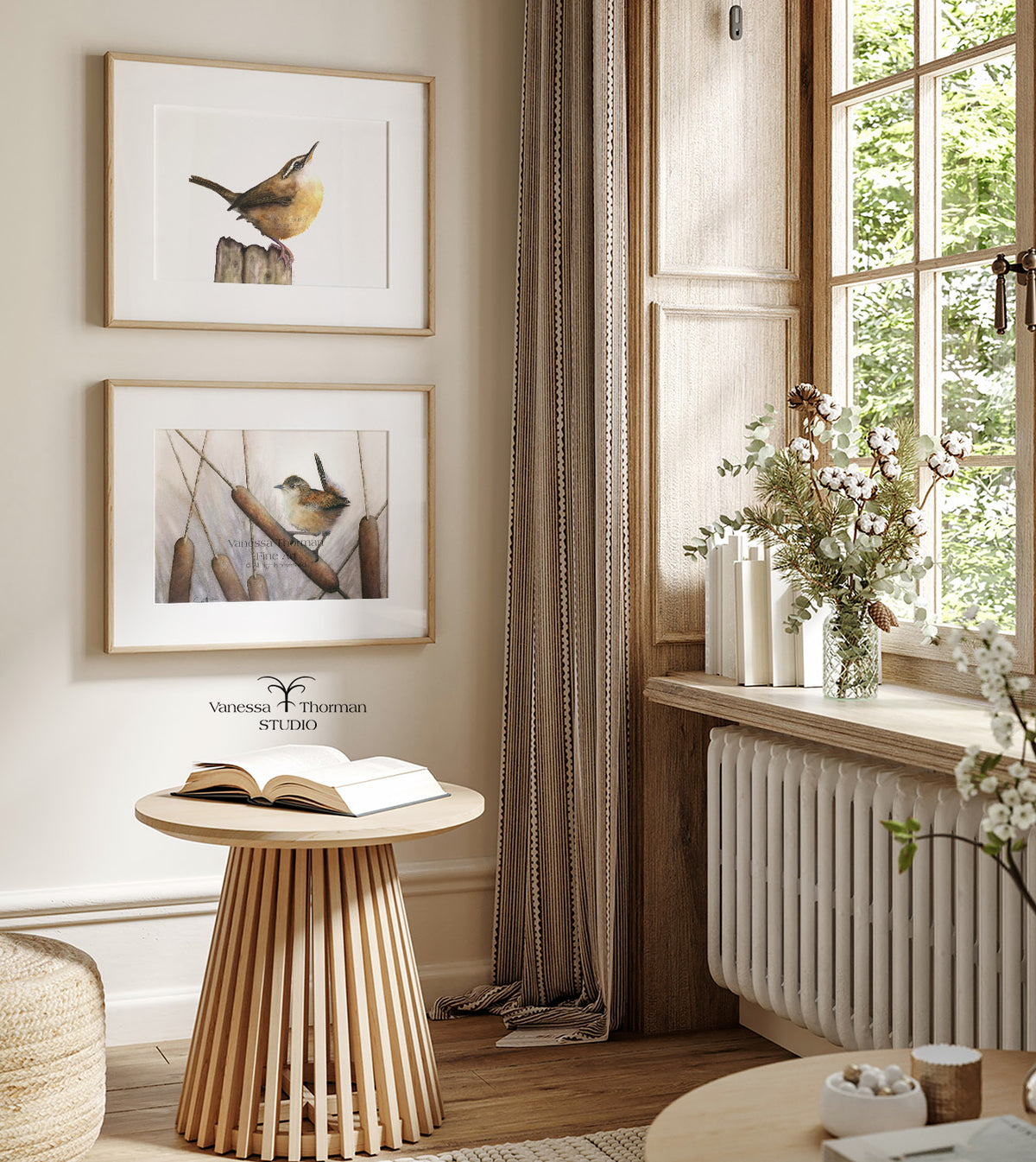 Two framed wren watercolor art prints hanging on a wall 