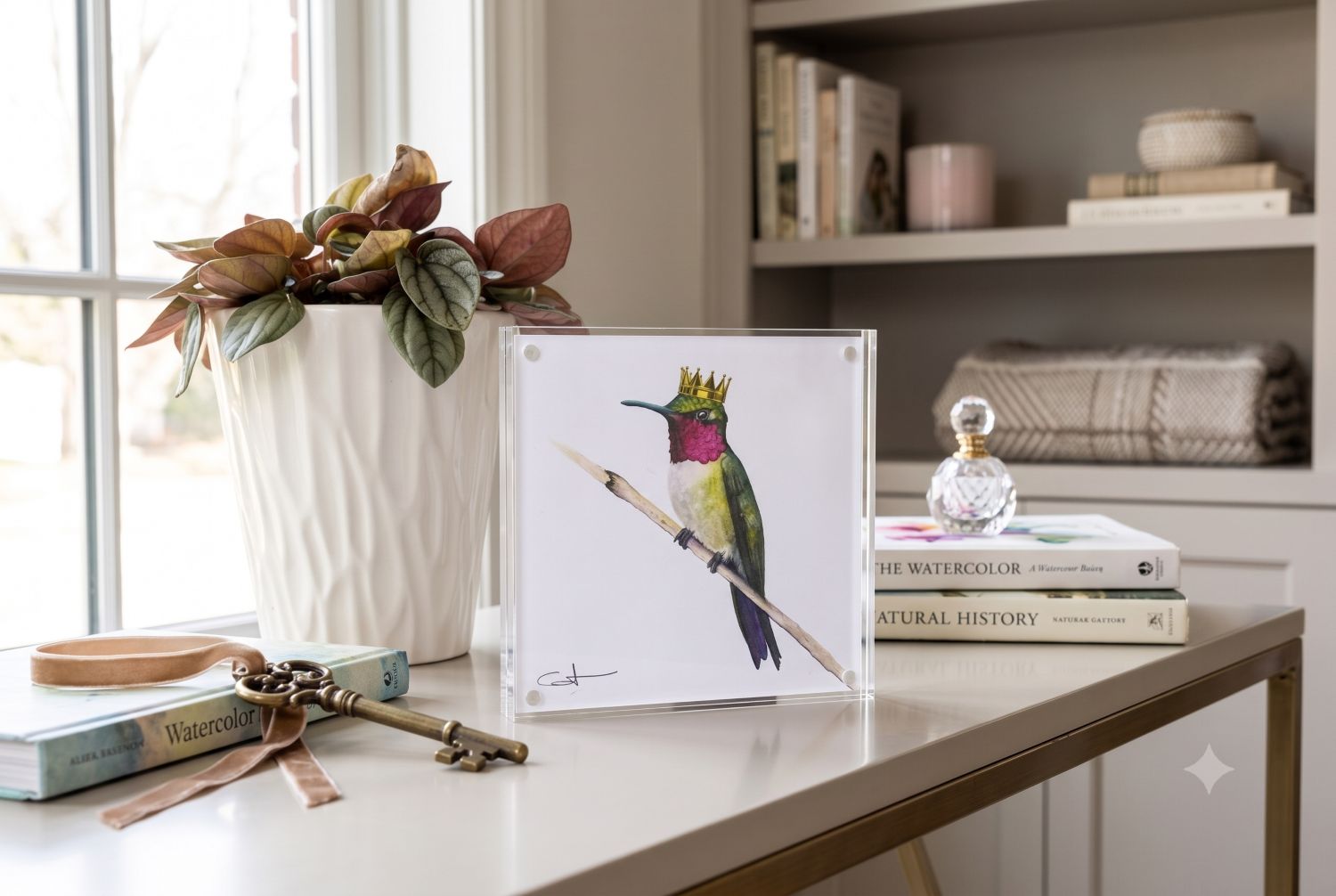 Ruby the Hummingbird acrylic block art print displayed on a console table