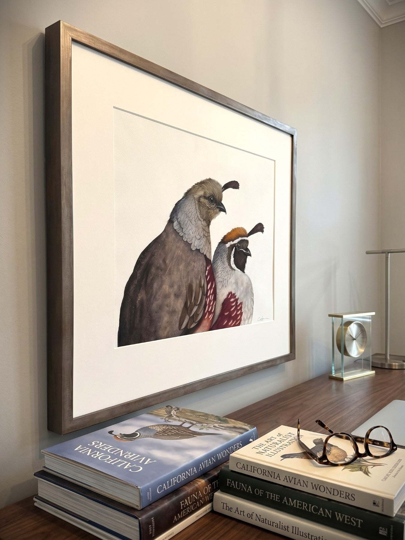 Framed Take a Gambel Quail Art Painting over a desk.