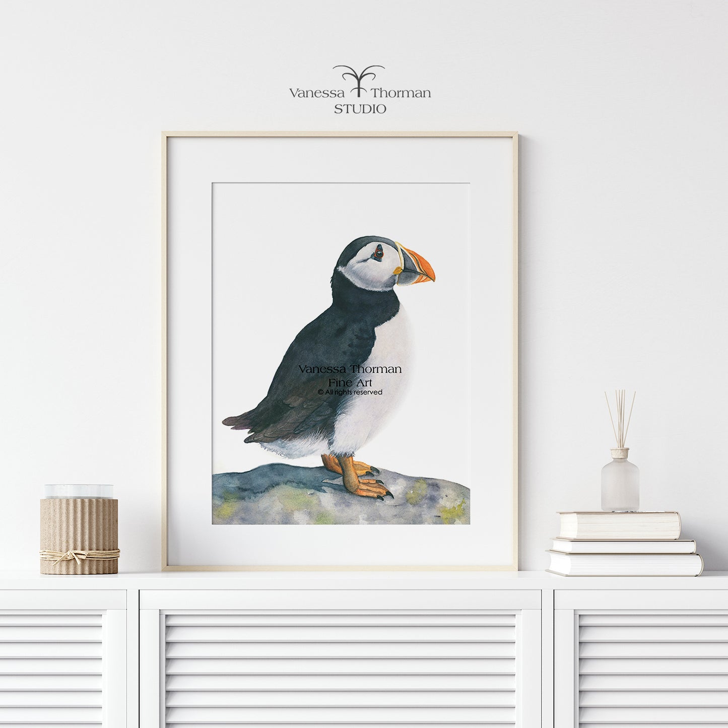Framed  atlantic puffin watercolor art print by Vanessa Thorman in a white frame