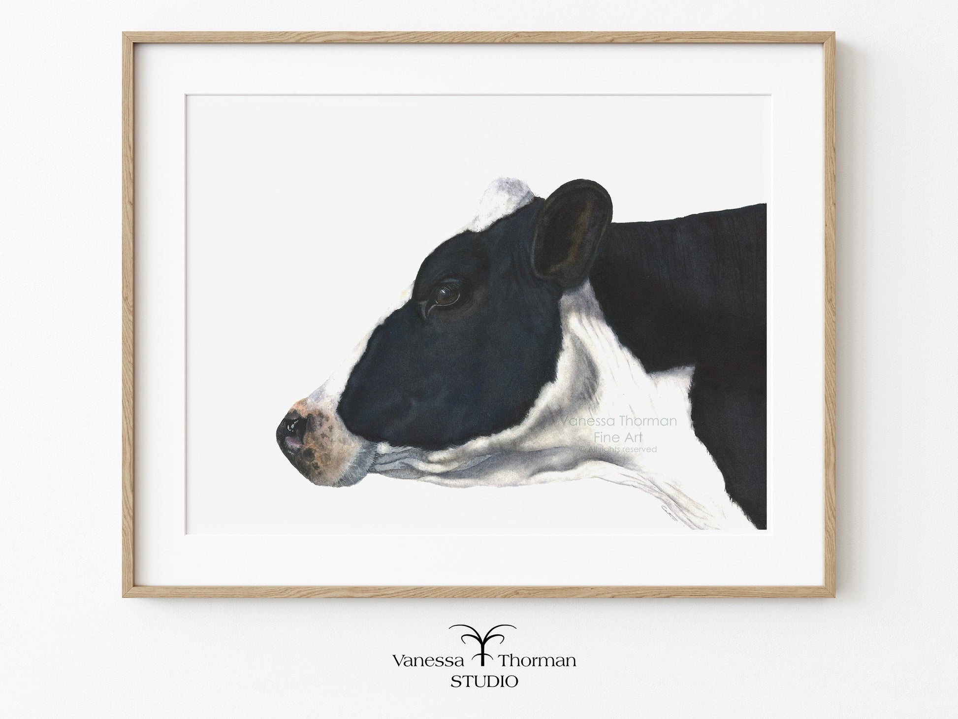 Framed "Belle of the Ball" Holstein Cow watercolor art print on a white background by Vanessa Thorman