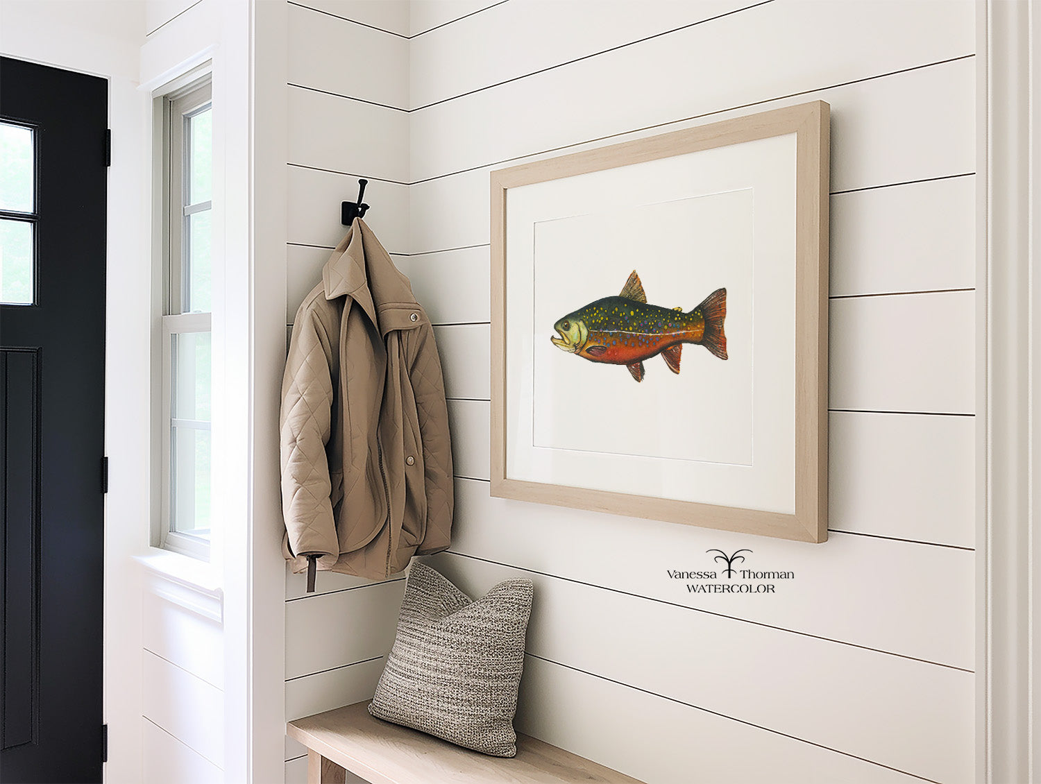 Framed Brook Trout watercolor art print hanging in an entryway