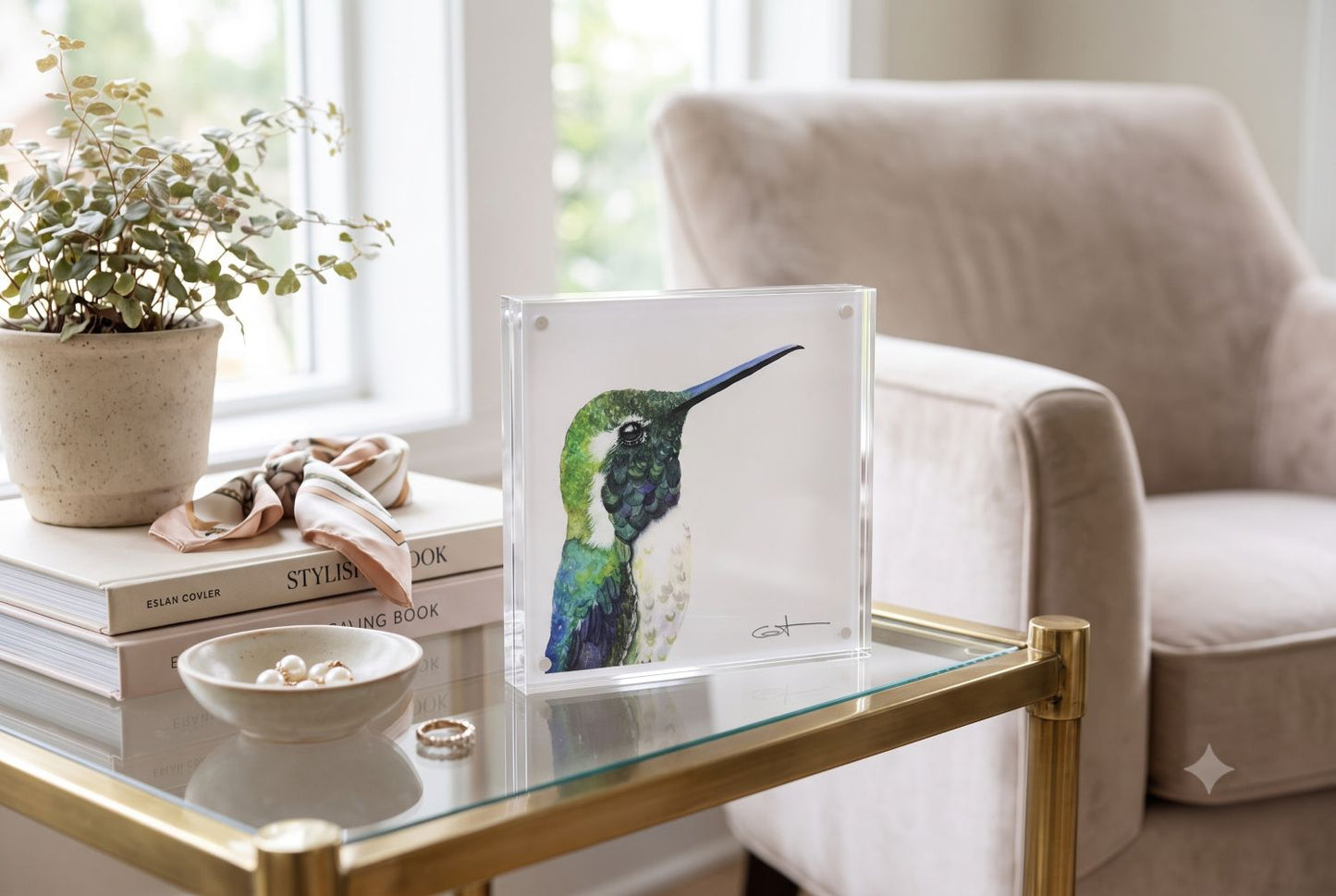Vincent the green hummingbird acrylic block art print displayed on an end table