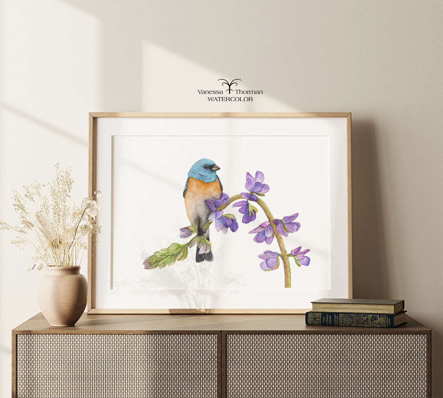 Framed "Bunting in Bloom" Lazuli Bunting watercolor art print displayed on a console table