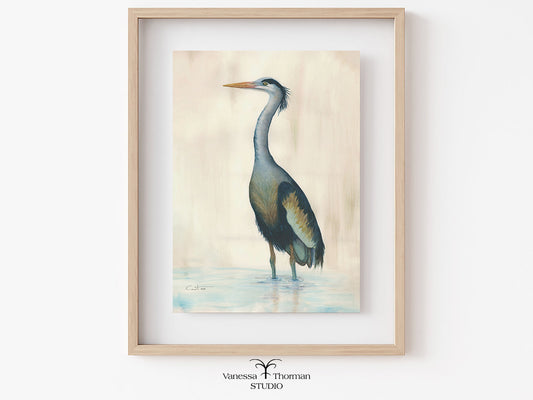 Framed "Marsh Heron in Blue" watercolor art print on a light background by Vanessa Thorman