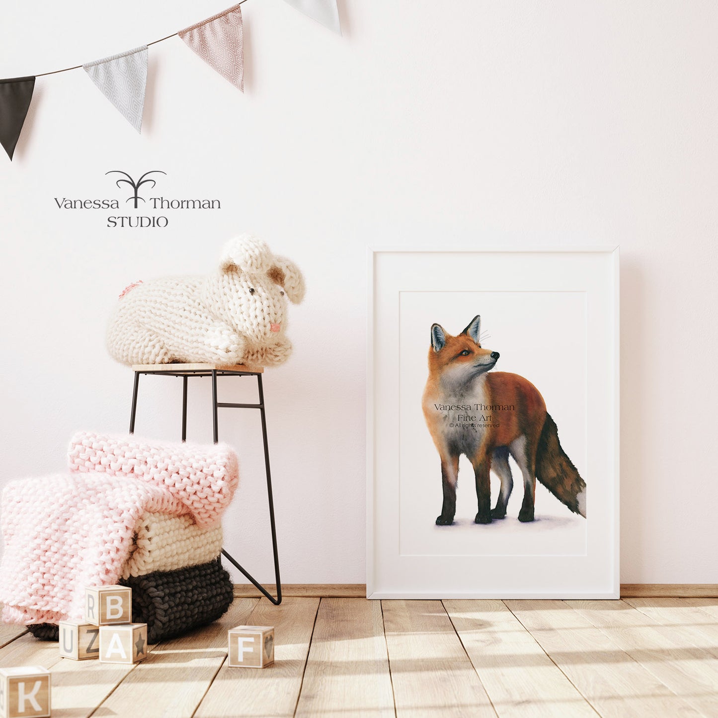 Framed Red Fox watercolor art print by Vanessa Thorman in a white frame, displayed in a nursery