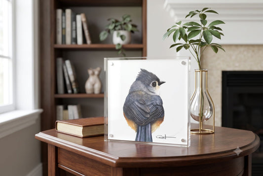 Tilly the Tufted Titmouse acrylic block art print displayed on an end table