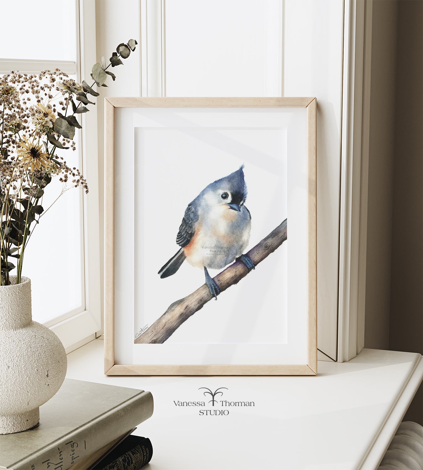 Framed Tufted Titmouse watercolor art print by Vanessa Thorman on a windowsill