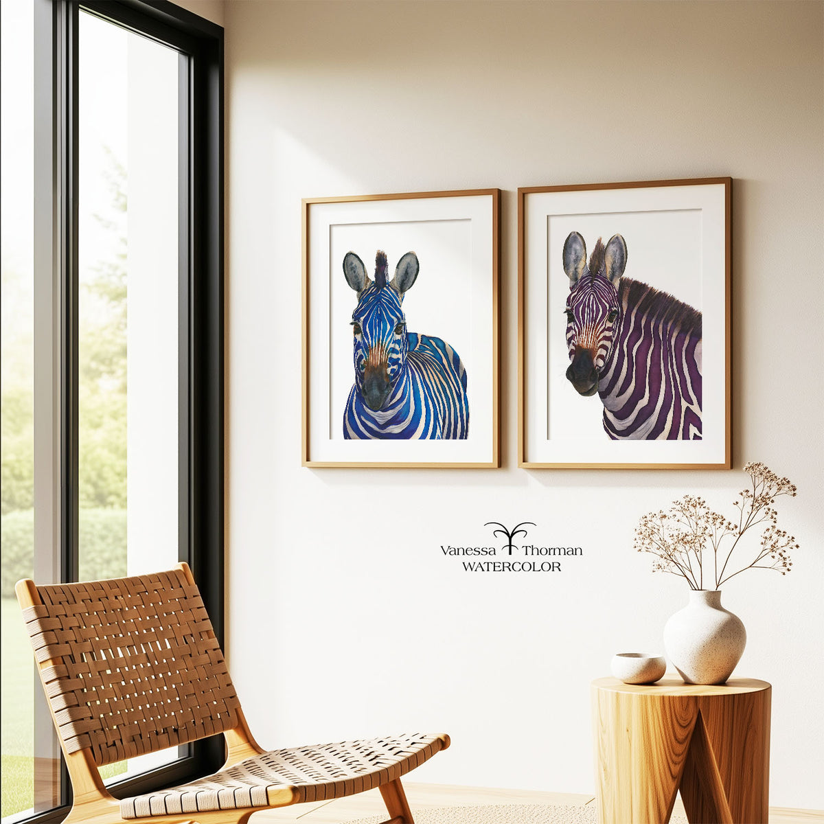 Two framed zebra watercolor art prints displayed together on a wall, including "Violeta" and Äzul"