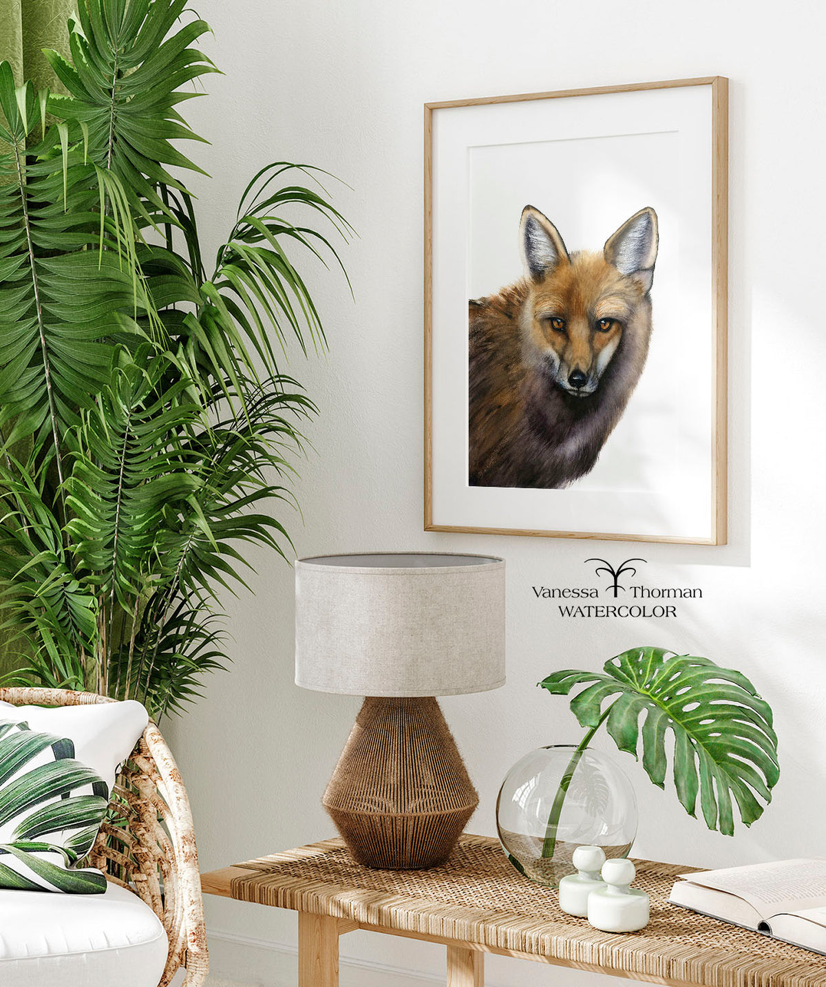 Framed "Your Move" fox watercolor art print by Vanessa Thorman displayed in a room with a palm plant